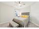 Bright bedroom with ceiling fan, comfortable bed, and window coverings at 6297 Raven Rock Dr, Denver, NC 28037