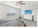 Bedroom with mounted TV, dresser, and carpet flooring at 6297 Raven Rock Dr, Denver, NC 28037