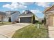 Two-car garage with a paved driveway and American flags at 6297 Raven Rock Dr, Denver, NC 28037