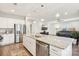 Modern kitchen with granite countertops, stainless steel appliances, and an island at 6297 Raven Rock Dr, Denver, NC 28037