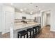 Modern kitchen with granite countertops, stainless steel appliances, and breakfast bar at 6297 Raven Rock Dr, Denver, NC 28037