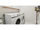 Convenient laundry room with washer, dryer, and overhead cabinets at 6297 Raven Rock Dr, Denver, NC 28037