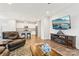 Living room features hardwood floors and an open layout to the kitchen at 6297 Raven Rock Dr, Denver, NC 28037