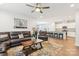 Open living room showcasing a kitchen with granite countertops and stainless steel appliances at 6297 Raven Rock Dr, Denver, NC 28037