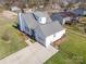 Aerial view of home featuring a fenced backyard, patio and manicured landscaping at 670 Sylvan Sw St, Concord, NC 28025