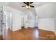 Bright bedroom features hardwood floors, closet and an opening to another room at 670 Sylvan Sw St, Concord, NC 28025