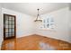 Bright dining room features a modern chandelier and hardwood flooring at 670 Sylvan Sw St, Concord, NC 28025