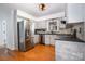 Modern kitchen with stainless steel appliances, granite countertops, and stylish backsplash at 670 Sylvan Sw St, Concord, NC 28025