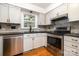 Updated kitchen featuring stainless steel appliances, stone countertops, and modern cabinetry at 670 Sylvan Sw St, Concord, NC 28025