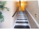 Stylish staircase with black and white painted steps at 6710 Elm Forest Dr, Charlotte, NC 28212