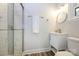 Clean bathroom with a walk-in shower, modern vanity, and updated fixtures at 7445 Briardale Dr, Charlotte, NC 28212