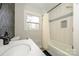 Clean bathroom with a tub, shower, and updated vanity at 7445 Briardale Dr, Charlotte, NC 28212