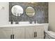 Modern bathroom with double sinks, designer wallpaper, and a herringbone tiled shower at 7445 Briardale Dr, Charlotte, NC 28212