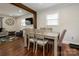 Simple dining area with wood table and chairs near living room at 7445 Briardale Dr, Charlotte, NC 28212