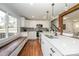 Updated kitchen featuring white shaker cabinets, quartz countertops, and a breakfast bar at 7445 Briardale Dr, Charlotte, NC 28212