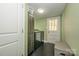 Convenient laundry room with washer, dryer, and extra storage at 7445 Briardale Dr, Charlotte, NC 28212