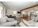 Open concept living room with a view into the kitchen and dining area at 7445 Briardale Dr, Charlotte, NC 28212