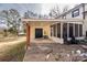 Covered patio with screened porch, perfect for outdoor relaxation at 7445 Briardale Dr, Charlotte, NC 28212