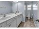 Bathroom with double vanity, tiled floor and bathtub shower combo at 7822 Meridale Forest Dr, Charlotte, NC 28269