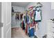 Walk-in closet with clothing and shelving at 7822 Meridale Forest Dr, Charlotte, NC 28269