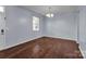 Light-filled dining room featuring hardwood floors at 7822 Meridale Forest Dr, Charlotte, NC 28269