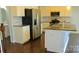 Modern kitchen with stainless steel appliances, granite countertops, and white cabinetry at 7822 Meridale Forest Dr, Charlotte, NC 28269