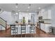 Modern kitchen with white cabinets, granite counters, and island at 7822 Meridale Forest Dr, Charlotte, NC 28269