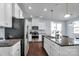 Modern kitchen with stainless steel appliances and granite island at 7822 Meridale Forest Dr, Charlotte, NC 28269