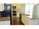 Modern kitchen with stainless steel appliances, granite countertops, and white cabinetry at 7822 Meridale Forest Dr, Charlotte, NC 28269
