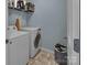 Laundry room with washer, dryer, and shelving at 7822 Meridale Forest Dr, Charlotte, NC 28269