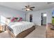 Main bedroom with large bed and ceiling fan at 7822 Meridale Forest Dr, Charlotte, NC 28269