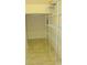 Walk-in pantry with tiled floor and wire shelving for ample storage space at 7822 Meridale Forest Dr, Charlotte, NC 28269