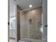 Large tiled shower with glass enclosure at 7822 Meridale Forest Dr, Charlotte, NC 28269