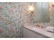 Charming bathroom boasts floral wallpaper and a white quartz vanity at 808 E Worthington Ave, Charlotte, NC 28203