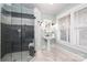 Elegant bathroom with a walk-in shower and pedestal sink at 808 E Worthington Ave, Charlotte, NC 28203