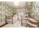 Charming bedroom with floral wallpaper and twin beds at 808 E Worthington Ave, Charlotte, NC 28203