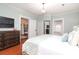 Main bedroom with hardwood floors and ensuite bathroom access at 808 E Worthington Ave, Charlotte, NC 28203