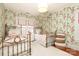 Charming bedroom with floral wallpaper and twin beds at 808 E Worthington Ave, Charlotte, NC 28203