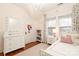 Light and airy bedroom with white dresser and twin bed at 808 E Worthington Ave, Charlotte, NC 28203