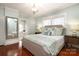 Main bedroom with hardwood floors and ensuite bathroom access at 808 E Worthington Ave, Charlotte, NC 28203