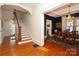 Elegant entryway with hardwood floors and a staircase leading upstairs at 808 E Worthington Ave, Charlotte, NC 28203