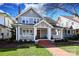 Gray two-story house with white columns and brick walkway at 808 E Worthington Ave, Charlotte, NC 28203