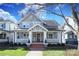 Charming two-story home with a welcoming front porch and landscaped yard at 808 E Worthington Ave, Charlotte, NC 28203