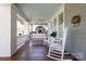 Spacious front porch with rocking chairs and wooden flooring at 808 E Worthington Ave, Charlotte, NC 28203