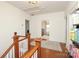 Upstairs hallway with hardwood floors and access to bedrooms at 808 E Worthington Ave, Charlotte, NC 28203