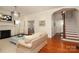 Elegant living room with hardwood floors, fireplace, and view of staircase at 808 E Worthington Ave, Charlotte, NC 28203