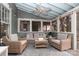 Cozy screened porch with seating area and ceiling fan at 808 E Worthington Ave, Charlotte, NC 28203