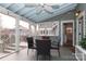 Screened porch with dining table and chairs, offering outdoor space at 808 E Worthington Ave, Charlotte, NC 28203