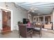 Screened porch with dining area and view of backyard at 808 E Worthington Ave, Charlotte, NC 28203