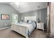 Bright bedroom with white furniture and ensuite bathroom at 874 Ledgestone Ct, Fort Mill, SC 29708